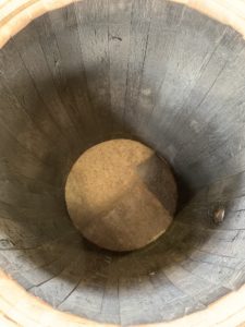 The dusty charcoal color of the inside of a charred barrel