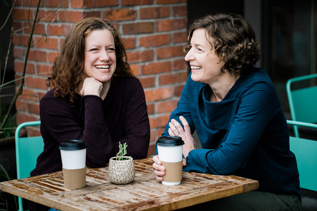 Cynthia Graber and Nicola Twilley at a table, drinking tea.